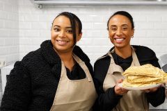 Friends enjoying a hands-on French crepe making class together in Paris.