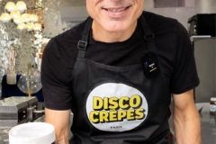 Chef Bertrand holding a jar of Nutella during a crepe making class at Disco Crêpes in Paris.