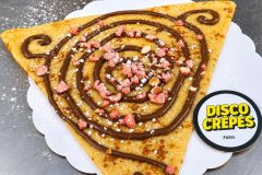 French crepe topped with Nutella and crushed freeze-dried strawberries at Disco Crêpes in Paris.