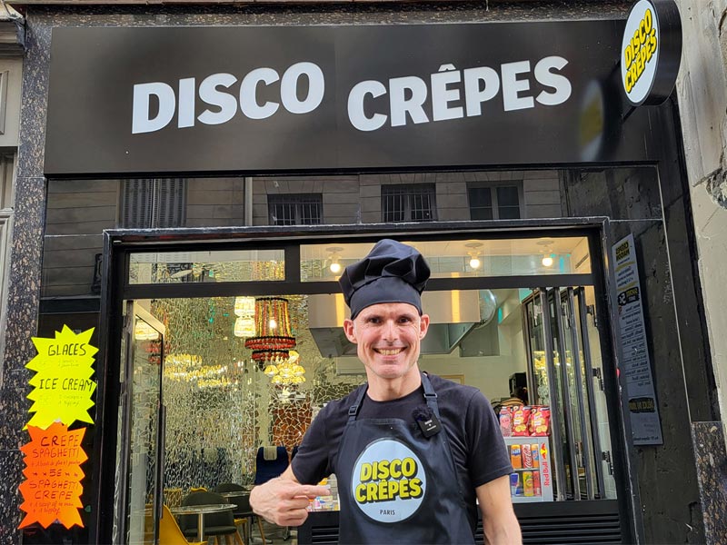 Chef standing outside Disco Crêpes, venue for a crepe making class in Le Marais, Paris.